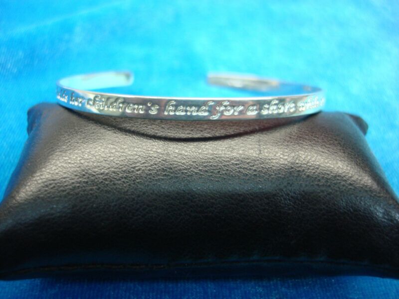 Sterling silver cuff bracelet engraved with a touching quote about mothers.