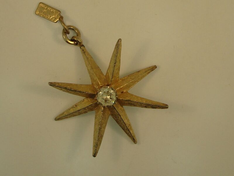 Vintage Kramer of New York gold tone star pendant with rhinestone accents, 1970s-80s