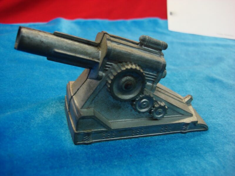 Vintage cast metal toy cannon, spring-loaded, 5 inches with slight imperfection