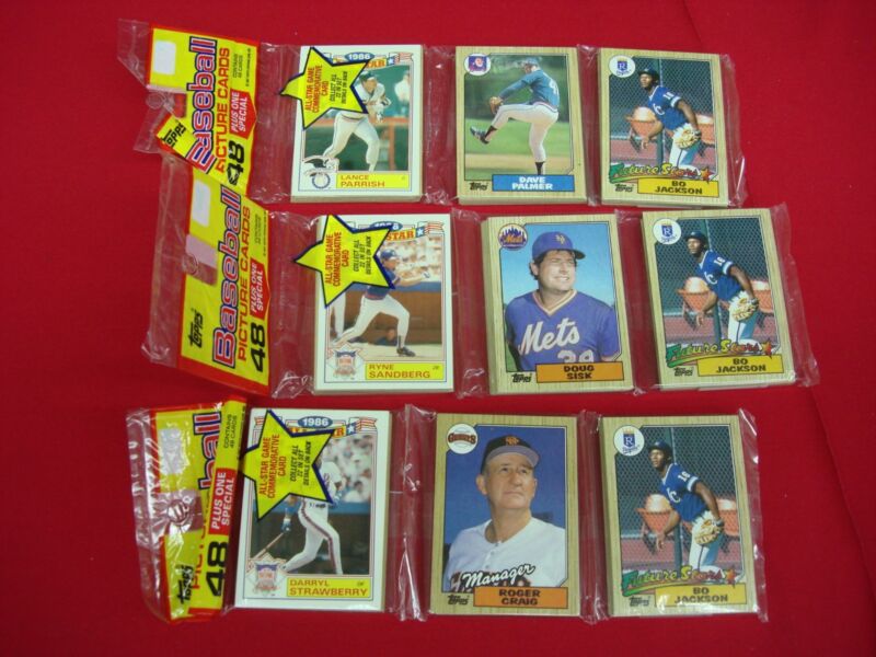 Lot of 3 factory-sealed 1987 Topps baseball rack packs featuring Bo Jackson rookie card, Darryl Strawberry and Ryne Sandberg.