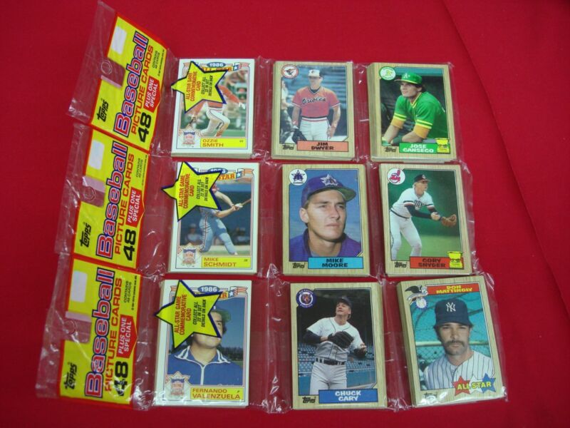 Vintage sealed 1987 Topps Baseball Rack Packs featuring Jose Canseco, Mike Schmidt, Don Mattingly, Ozzie Smith and Fernando Valenzuela.