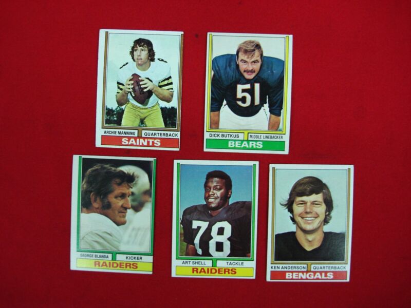 Five vintage 1974 Topps Football cards featuring Archie Manning, Dick Butkus, George Blanda, Art Shell, and Ken Anderson.