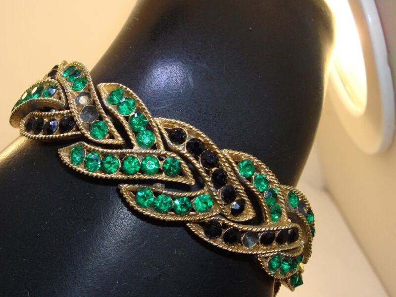 Vintage 1963 Trifari crown bracelet with green and black rhinestone cavalcade design