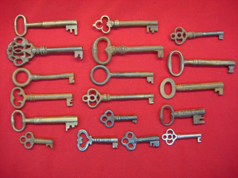 Set of 18 antique hollow barrel cabinet and door keys in antique brass