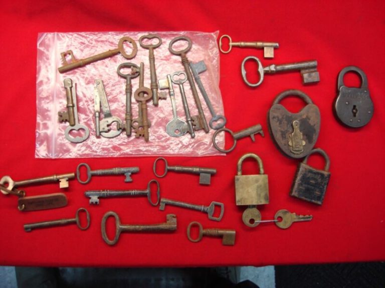 Vintage padlocks and keys collection, including an antique military padlock