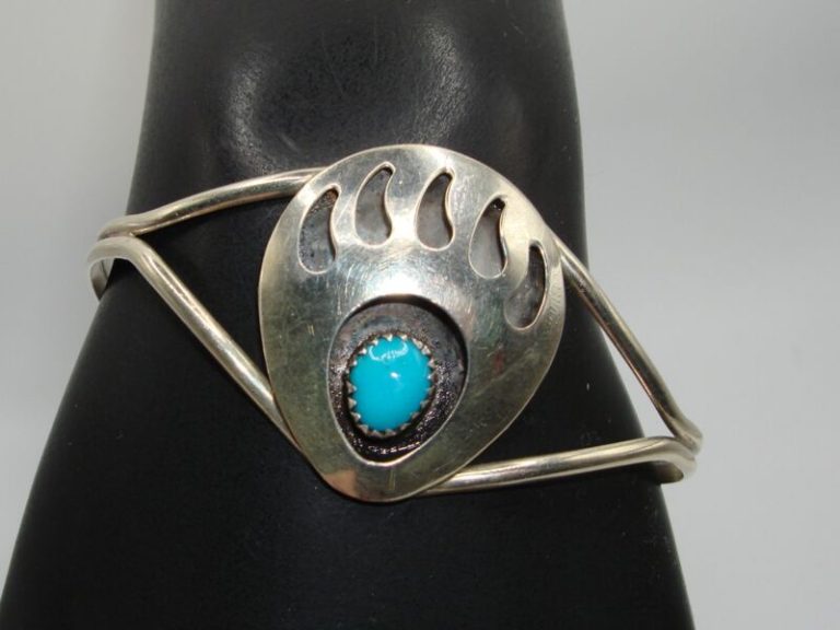 Vintage Native American sterling silver and turquoise cuff bracelet with bear claw design