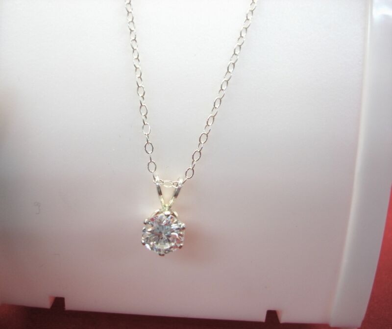 Sparkling sterling silver pendant necklace with a 6.4mm cubic zirconia stone and a 20-inch chain