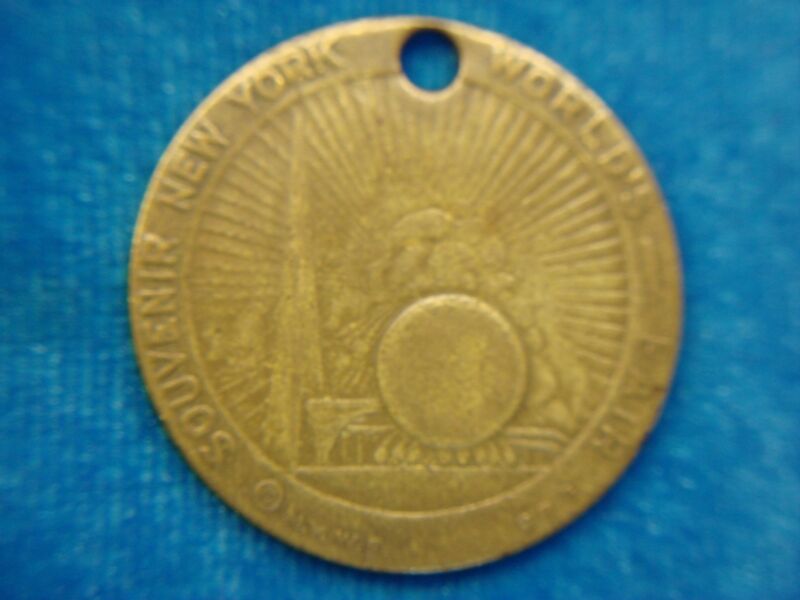 Vintage brass souvenir pendant/keychain from the 1939-40 New York World's Fair, featuring Billy Rose's Aquacade.