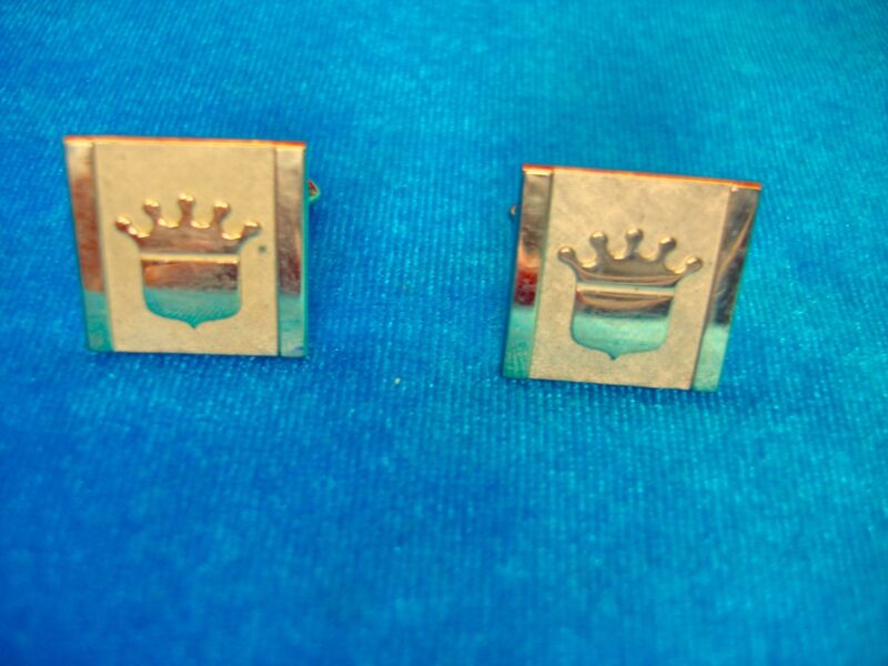 Vintage gold-tone cufflinks with a crest, pre-owned estate jewelry