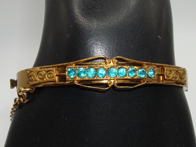 Vintage Coro gold-tone bangle bracelet with blue rhinestones (1930s-40s)
