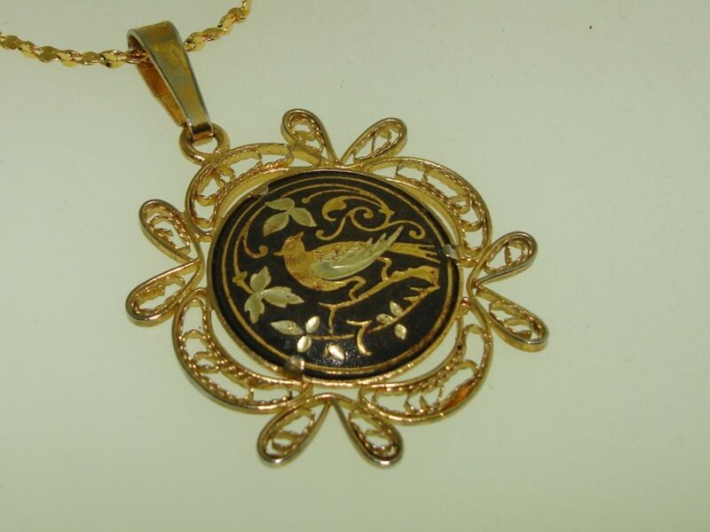 Vintage gold-plated filigree enamel pendant necklace with damascened bird motif