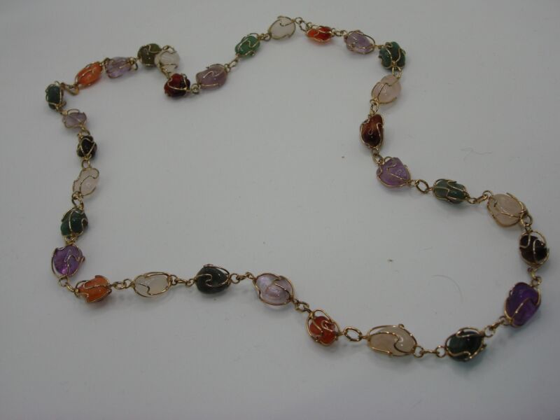 Vintage 1960s-70s gemstone necklace featuring amethyst, aventurine, onyx, and quartz