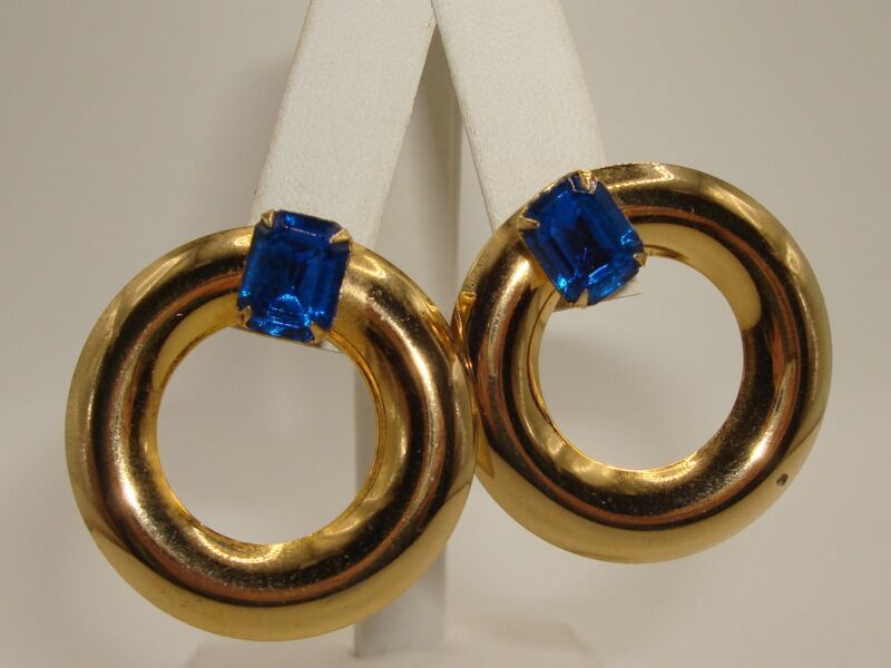 Vintage gold-tone rhinestone hoop earrings with blue glass stones