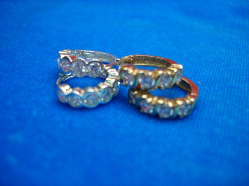Sterling silver and gold vermeil hinged hoop earrings with sparkling cubic zirconia
