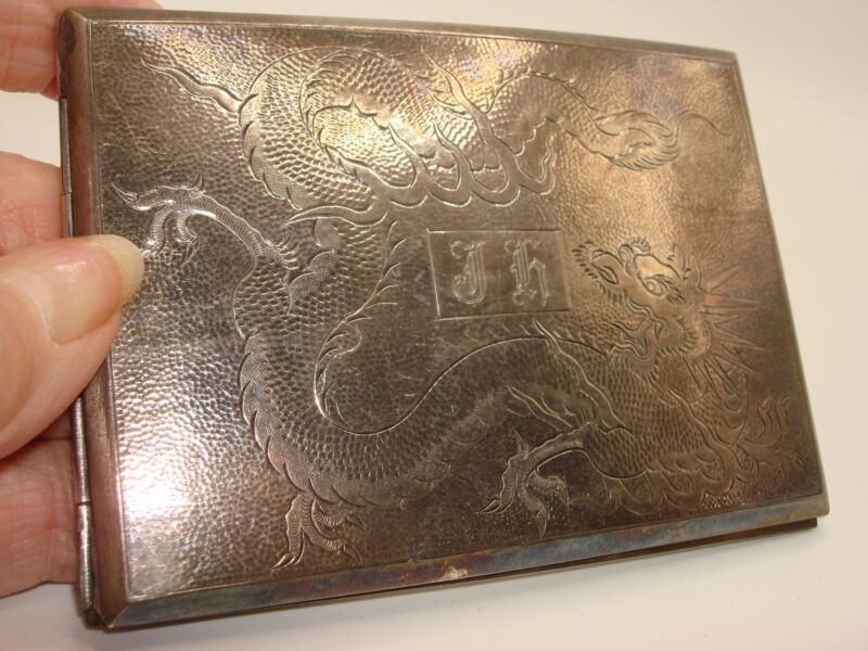 Antique Chinese silver cigarette case with a dragon design and hallmark TH 90%