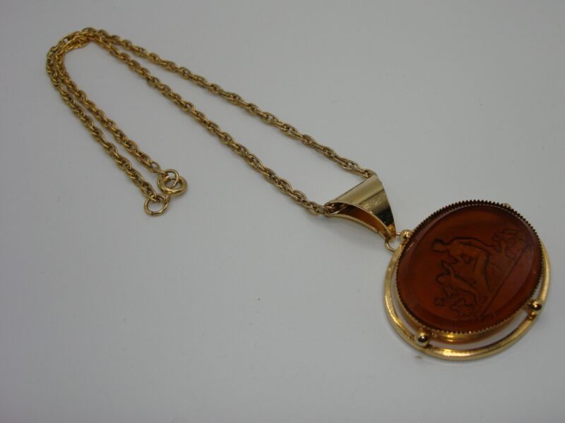 Vintage carnelian glass pendant necklace with reverse carved mother and angel design