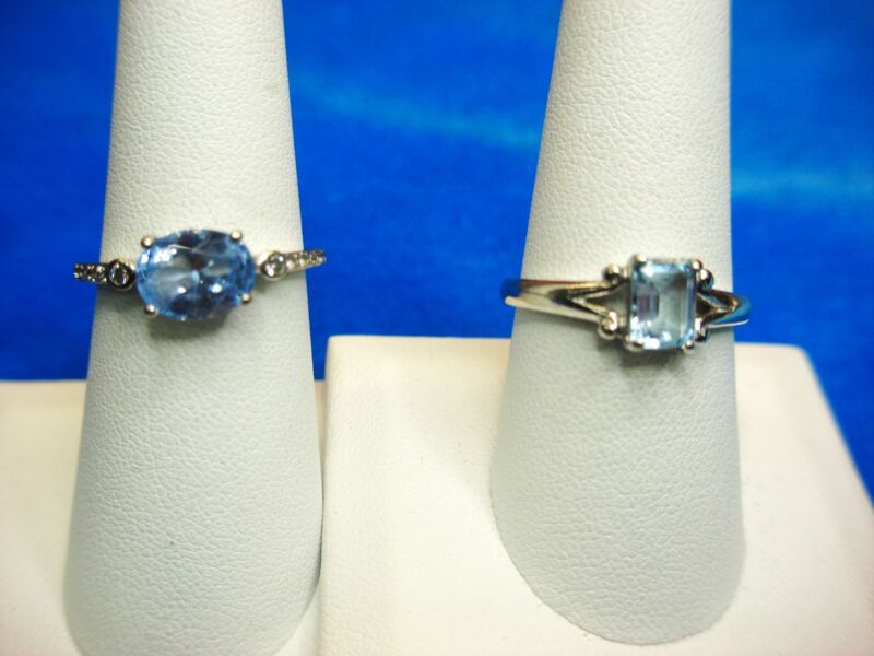 Sterling silver rings set with light blue CZs in oval and emerald cuts, sizes 8 3/4 & 7