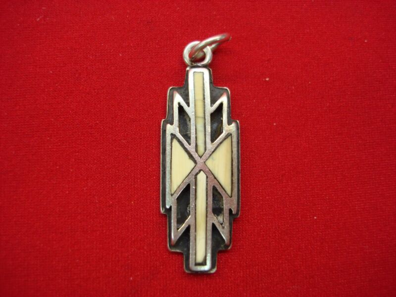 Vintage sterling silver pendant with southwest design and black enamel