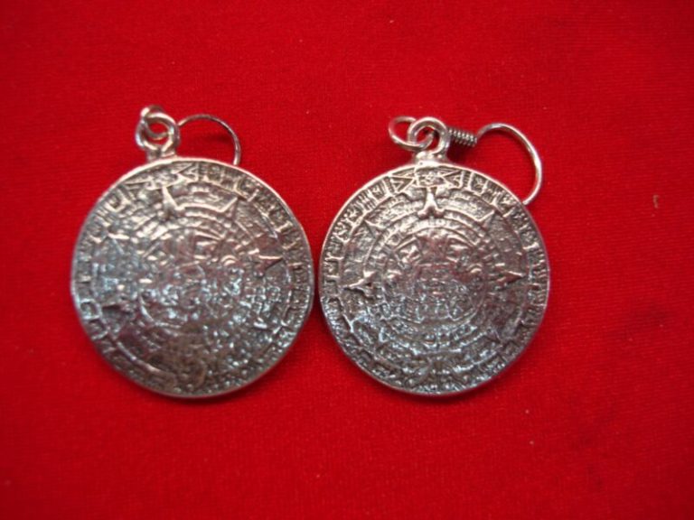 Vintage Taxco sterling silver dangle earrings featuring the Aztec calendar design
