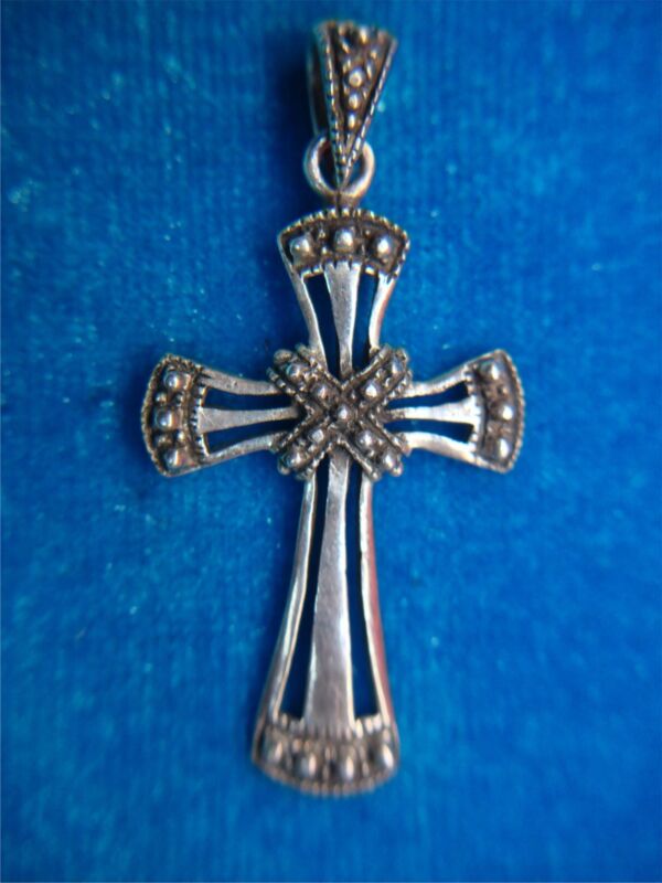 Vintage sterling silver cross pendant with intricate design