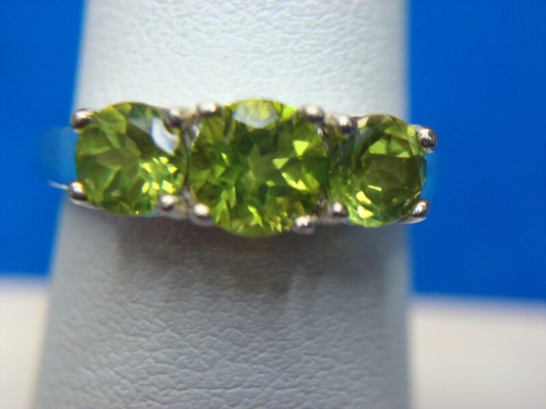 Sterling silver ring with three green gemstones