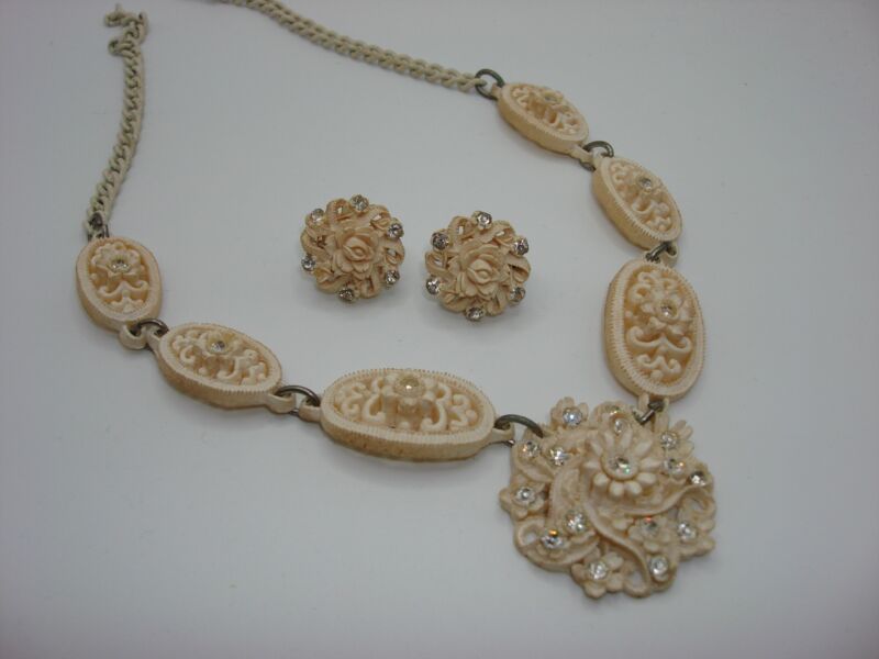 Art Deco celluloid choker necklace and earrings set with rhinestone floral design