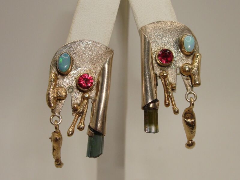 Vintage modernist earrings featuring pink tourmaline and opal accents set in sterling silver and gold.