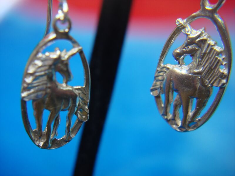 Sterling silver horse earrings with intricate design, pre-owned and elegant