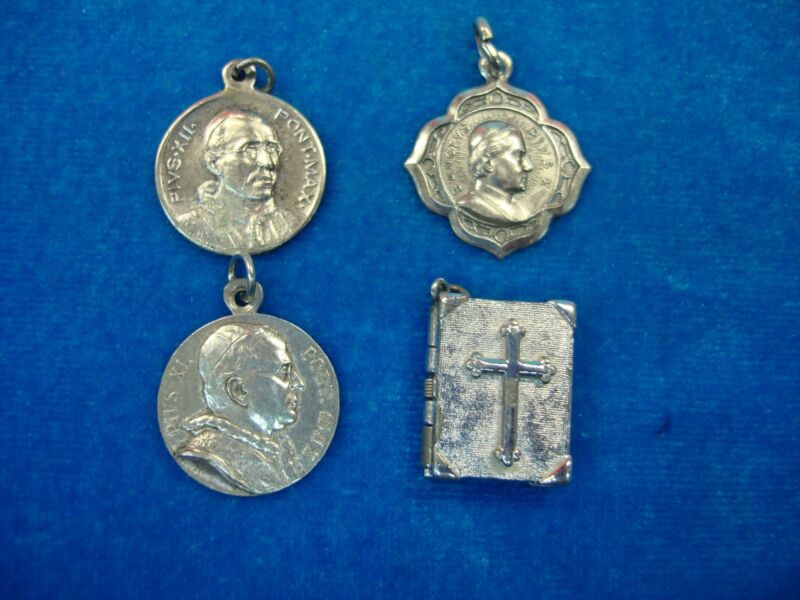 Vintage Catholic charms set featuring Pope Pius X, XI, and XII, plus a Lord's Prayer bible charm.