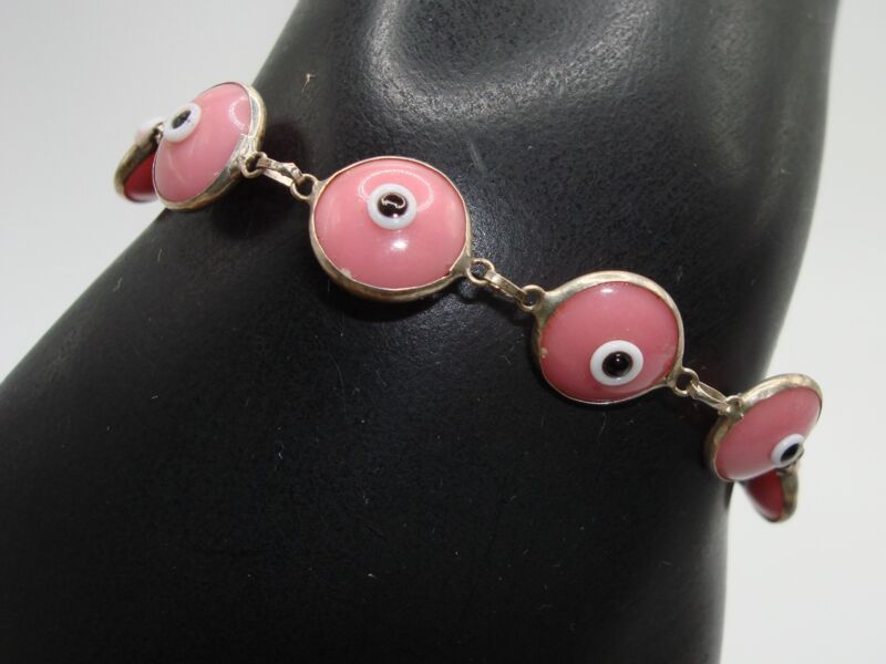 Sterling silver bracelet with pink glass evil eye charms