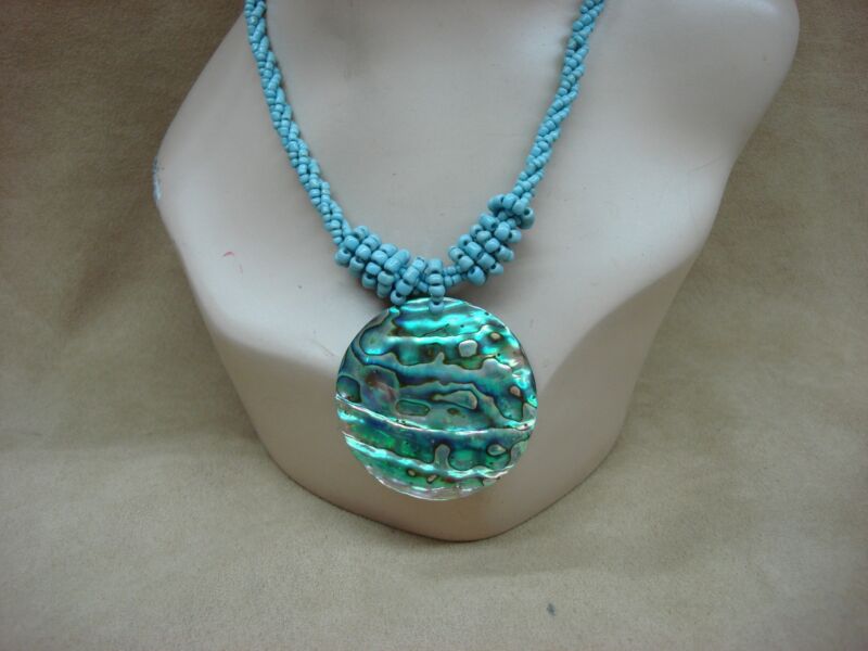 Handcrafted Lee Sands paua and abalone pendant necklace with iridescent disc