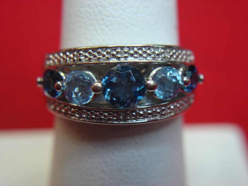 Sterling silver ring with dark blue and light blue flashing stones, size 6.5