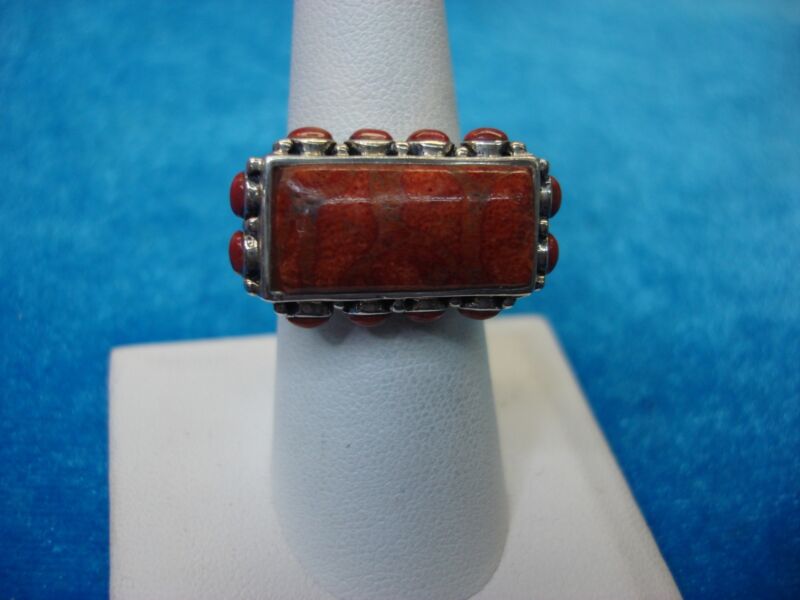 Sterling silver ring with red coral accents, size 7.5
