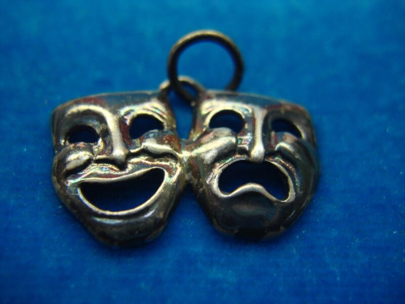 Sterling silver pendant featuring Happy and Sad Masks, a symbol of theatrical expression.