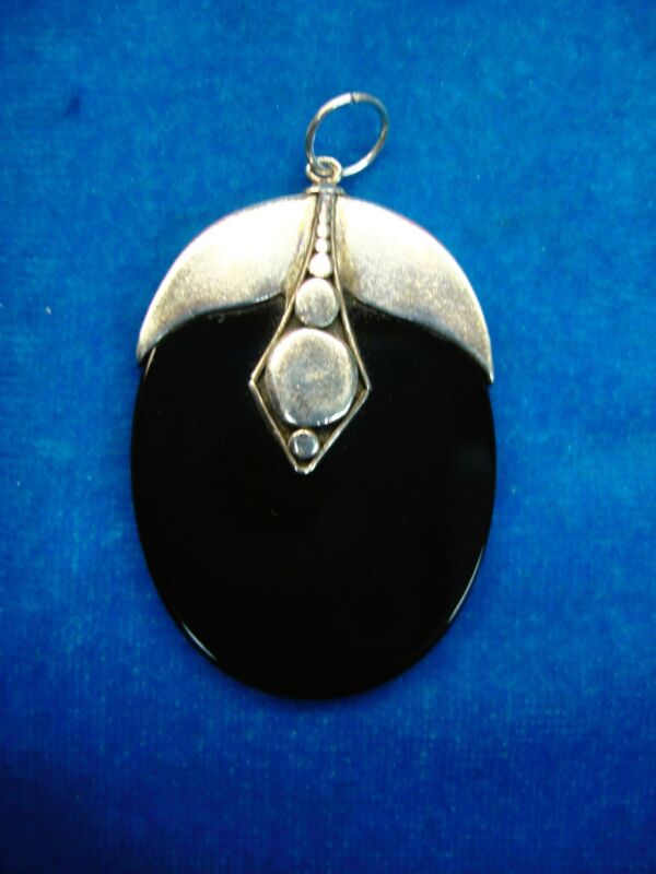 Handmade sterling silver and onyx pendant
