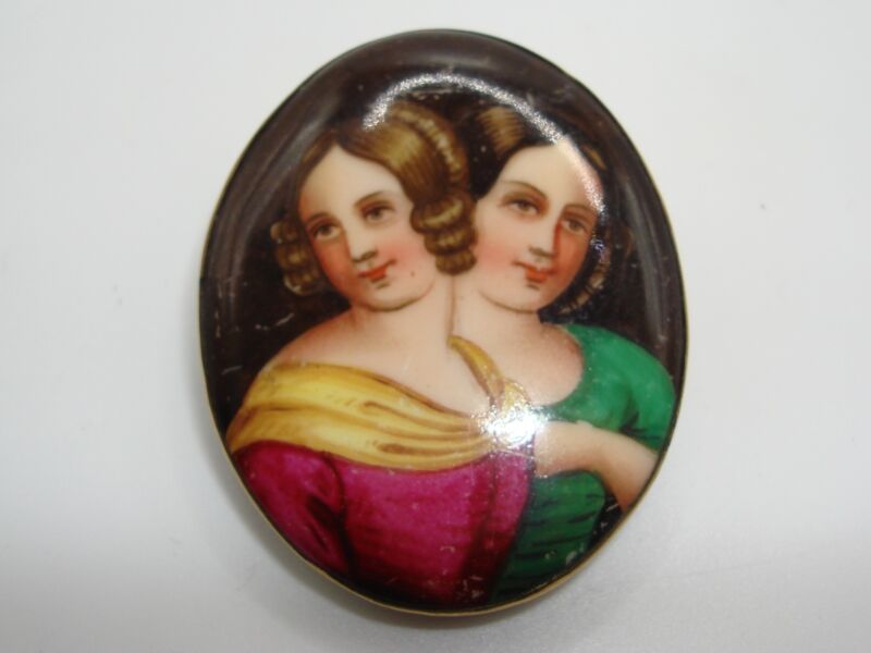 Antique Victorian era brooch with hand-painted enamel on porcelain depicting two women
