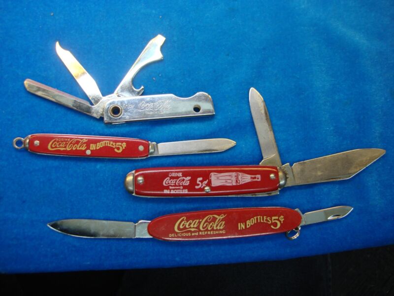 Set of 4 Coca-Cola collectible keychain knives in excellent condition