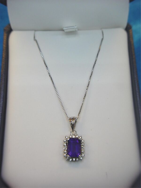 Elegant emerald cut amethyst pendant necklace in sterling silver (18")