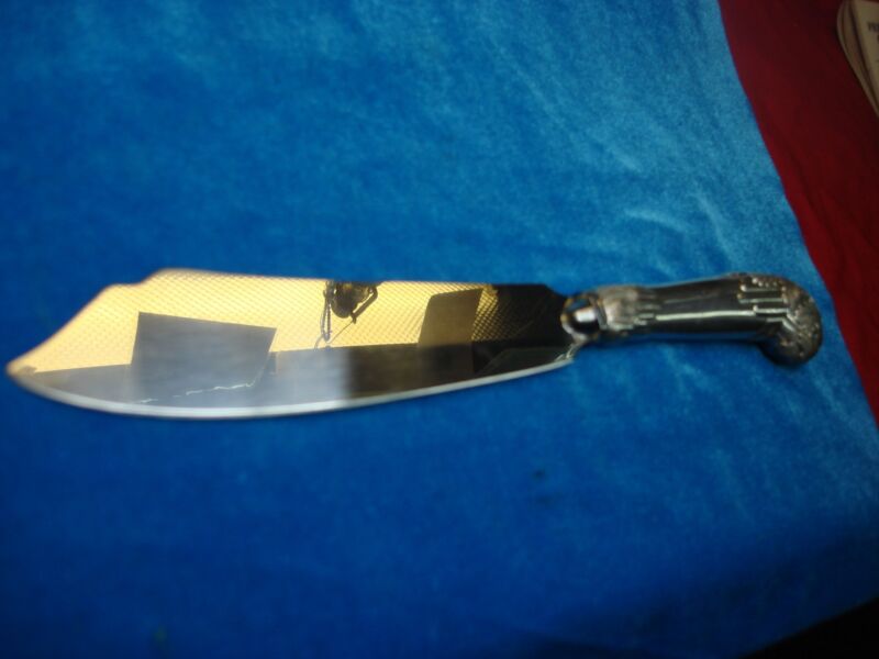 Antique sterling silver cake knife with ornate handle