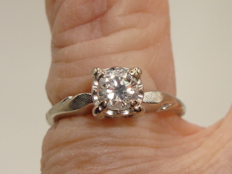 Vintage 14K white gold engagement ring with a personalized inscription and a 1/3ct SI2 diamond