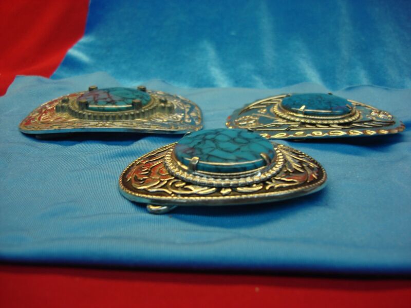 Set of three Western-style belt buckles with faux turquoise accents