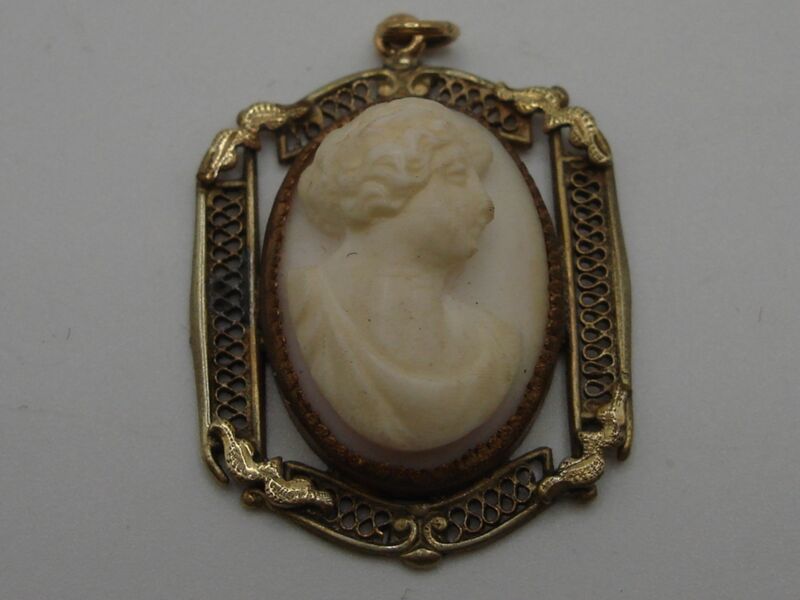 Antique carved shell cameo pendant with filigree, featuring a vintage lady portrait