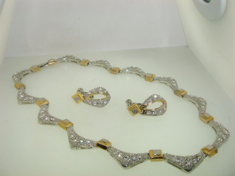 Silver and gold-tone necklace and earring set with cubic zirconia stones