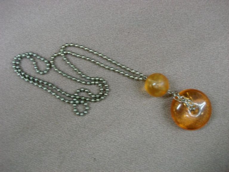 Vintage 1960s-70s orange lucite mod necklace with frosted ball pendant