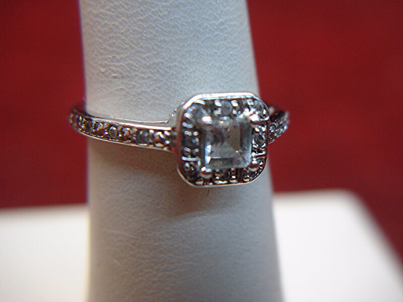 Pale blue princess cut sterling silver ring with CZ accents, size 7