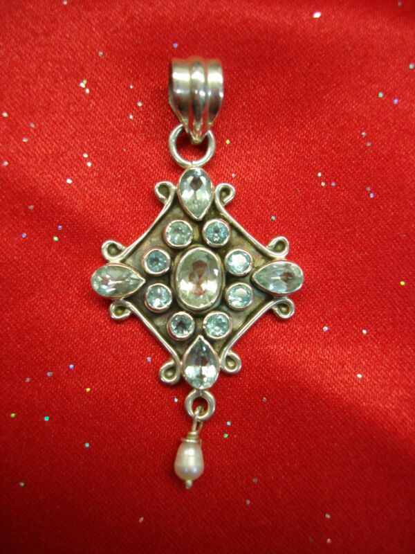 Sterling silver pendant with blue topaz stones and a freshwater pearl