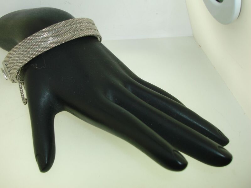 Vintage silver mesh hinged bangle bracelet from the 1950s or 1960s