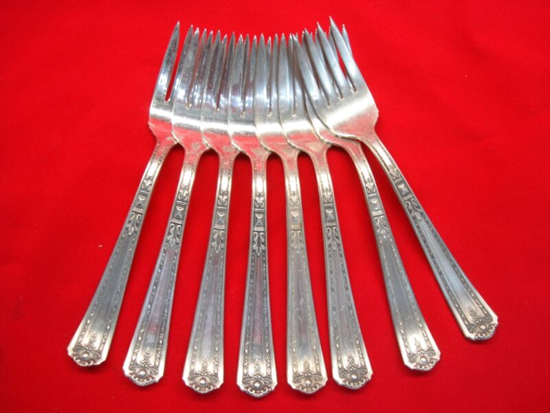 Set of eight vintage National Silver Company Florence pattern salad forks in EPNS silverplate.