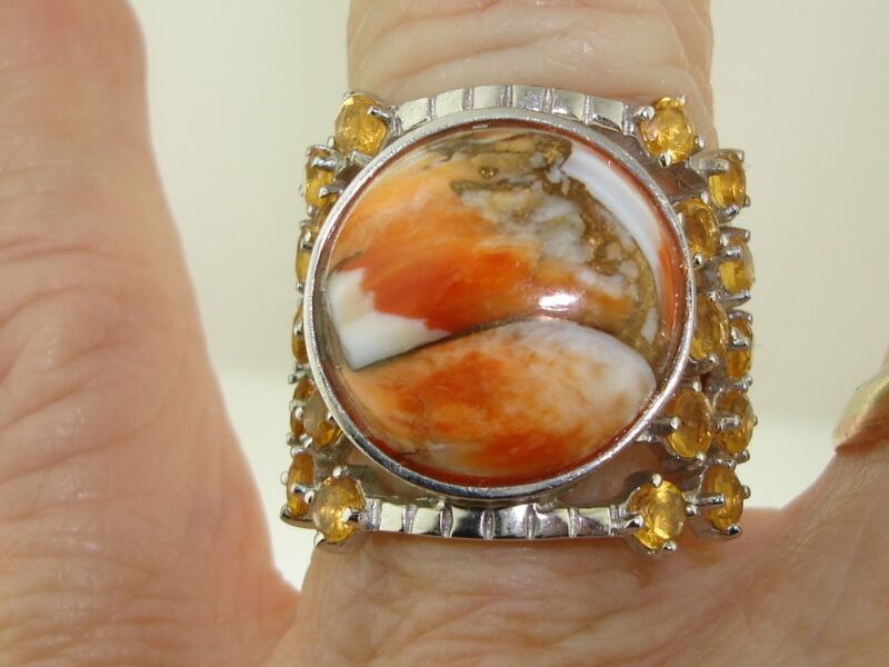 Sterling silver ring with orange and white jasper stones, gold flecks, and rhinestones
