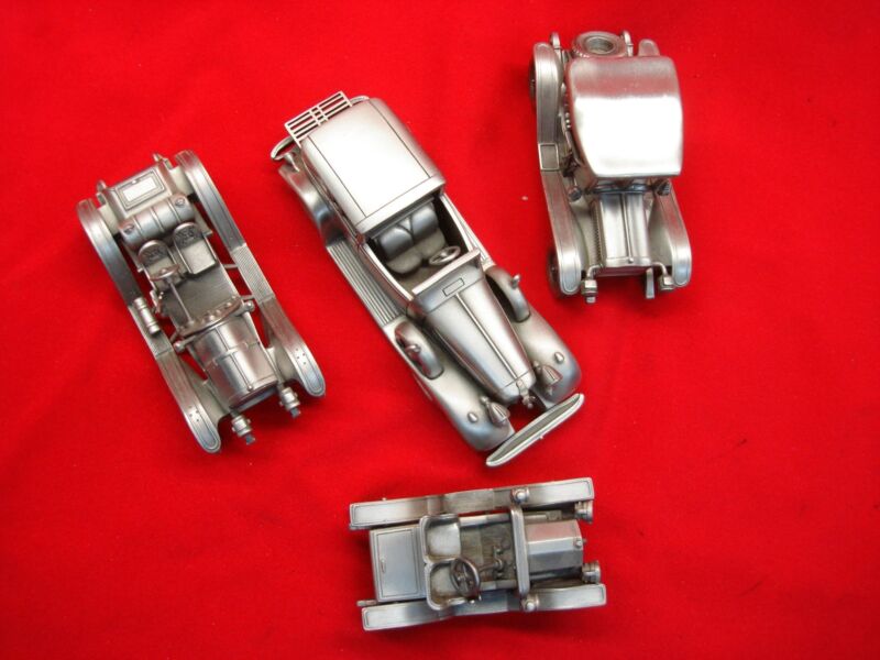 Danbury Mint antique car model set featuring four detailed pewter vehicles